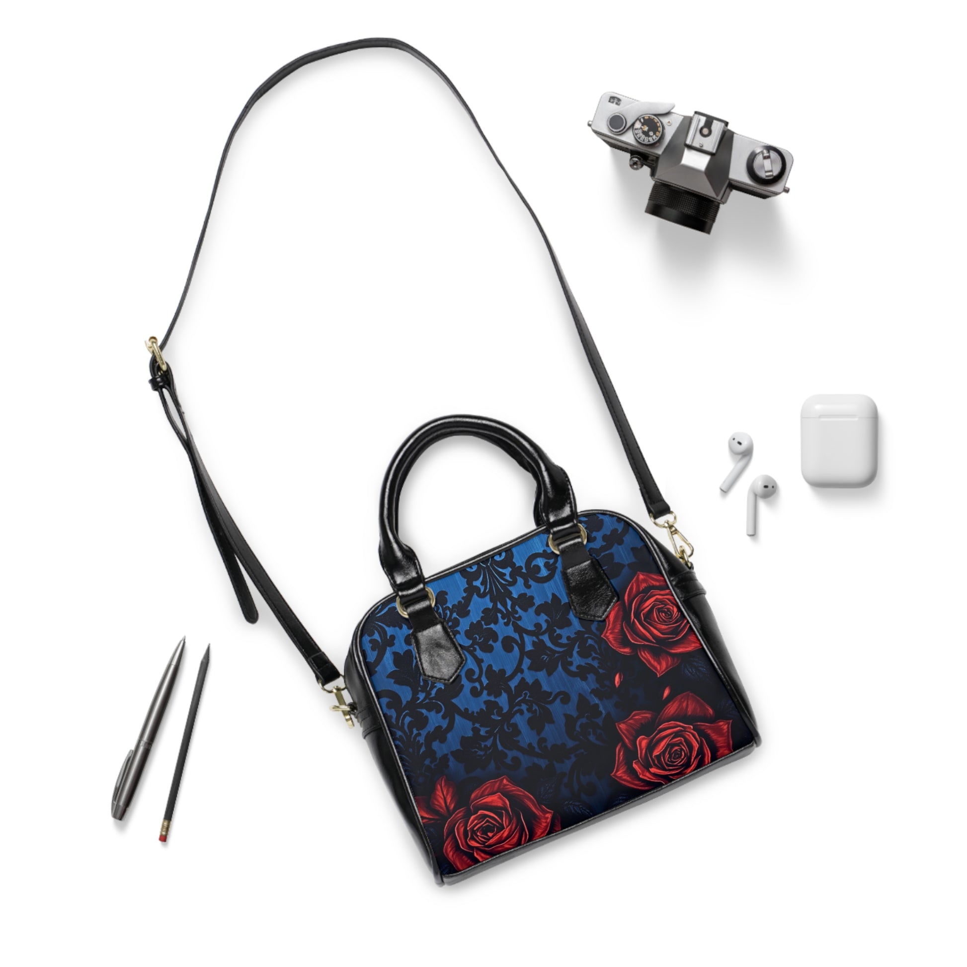 Stylish Copy of Sugar Candy Skull with Red Rose Shoulder Handbag featuring vibrant roses on a dark textured backdrop.